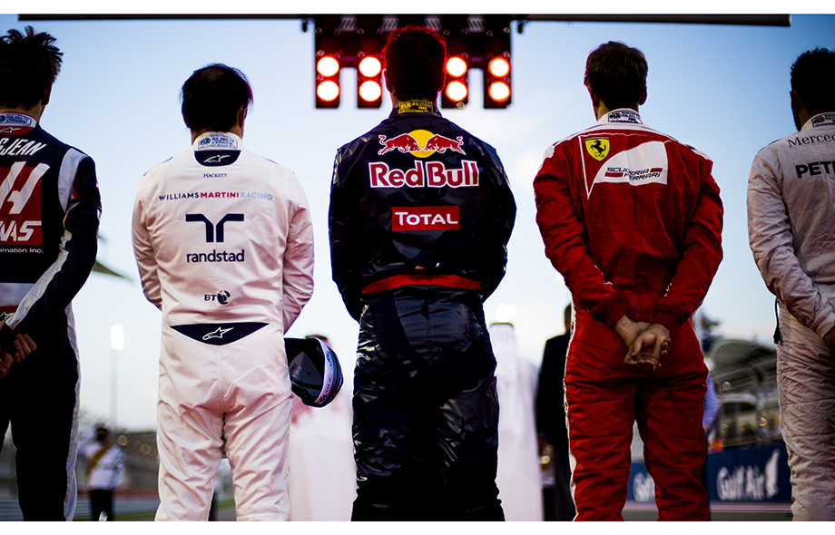 Daniel Ricciardo of Australia and Red Bull Racing stands for Bahrain national anthem prior to the Bahrain Formula One Grand Prix at Bahrain International Circuit on April 03, 2016 in Sakhir, Bahrain. Daniel Ricciardo of Australia and Red Bull Racing stands for Bahrain national anthem prior to the Bahrain Formula One Grand Prix at Bahrain International Circuit on April 03, 2016 in Sakhir, Bahrain.