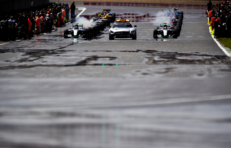 Race start behind a safety car is pictured during the British Formula One Grand Prix at on July 10, 2016 in Silverstone, Great Britain. Race start behind a safety car is pictured during the British Formula One Grand Prix at on July 10, 2016 in Silverstone, Great Britain.