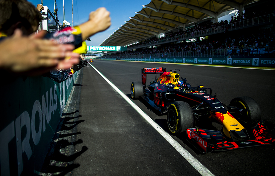Daniel Ricciardo of Australia and Red Bull Racing celebrates with his team following his win during the Malaysian Formula One Grand Prix at Sepang International Circuit on October 02, 2016 in Sepang, Malaysia. Daniel Ricciardo of Australia and Red Bull Racing celebrates with his team following his win during the Malaysian Formula One Grand Prix at Sepang International Circuit on October 02, 2016 in Sepang, Malaysia.